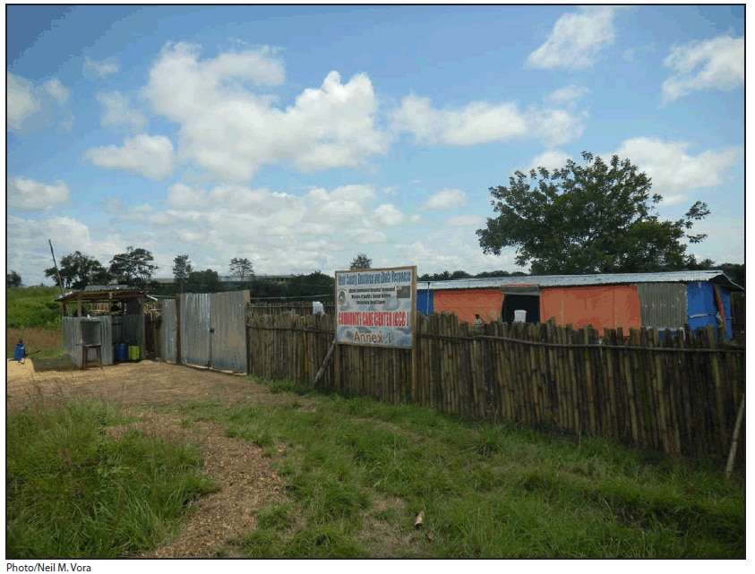 The figure is a photograph of the community care center in Bomi County, Liberia. In March 2014, the Bomi County Community Health Department built the isolation ward for Ebola patients adjacent to the county's single hospital after receiving news of the first Ebola case in Liberia.